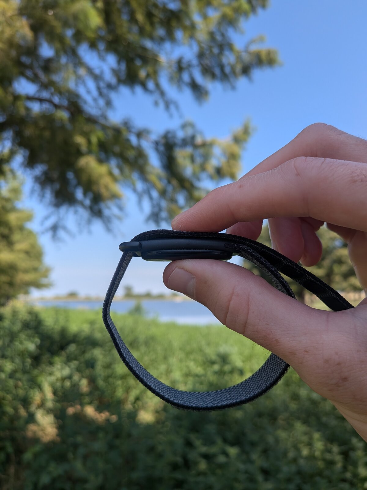 Google Fitbit Air screenless fitness tracker with an obsidian band outdoors